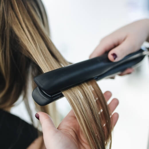 Applying Heat to Hair with a Flat iron